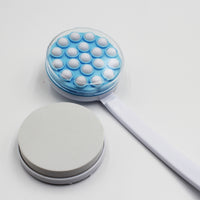 Homecraft Dual Function Lotion and Cream Applicator with round head, pumice stone and lotion feature, product laid flat, top view.