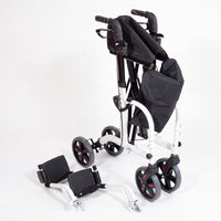 Aidapt Duo Deluxe Rollator with ergonomic handles and detachable footrests, folded on the floor, side view.