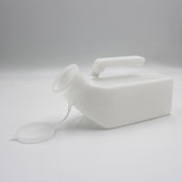 Homecraft Economy Male Urinal with handle and snap-on lid lying on its side, plain background, side view.
