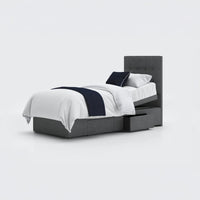 Opera Beds Emerald Motion adjustable divan bed with storage drawers and white comforter, front view.