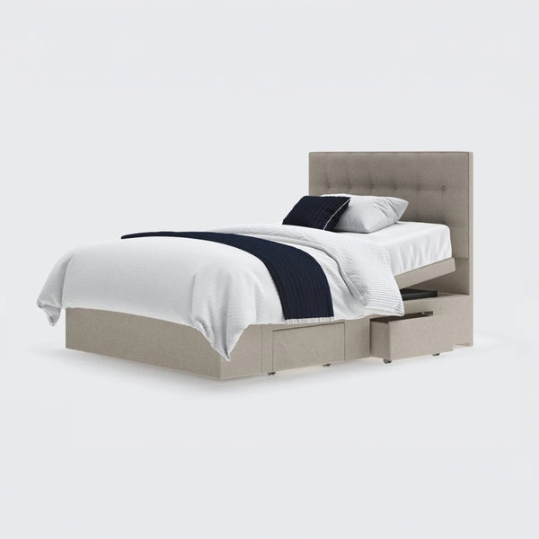 Emerald Motion Adjustable Divan Bed with white bedding, navy throw, pillows and two open drawers, side view.