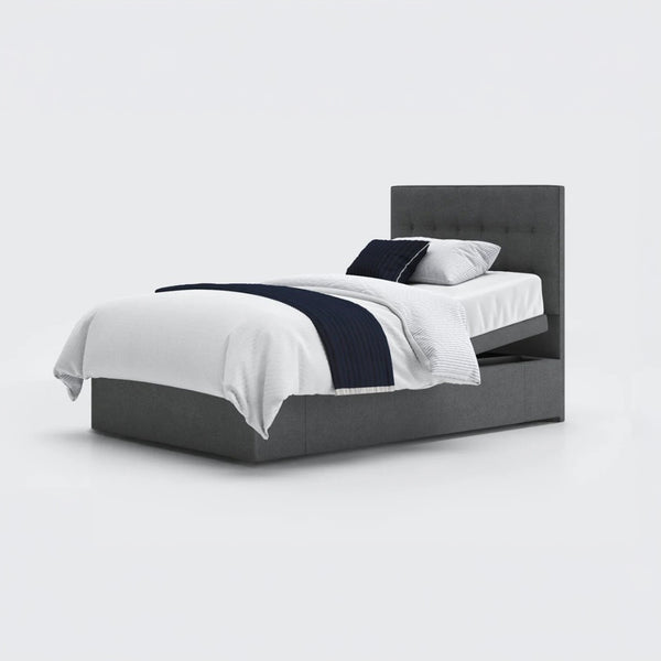 Opera Beds Emerald Motion Adjustable Divan Bed with white bedding, navy throw and pillows, white background, front view.