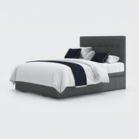 Opera Beds Emerald Motion Adjustable Divan Bed with white bedding, black accent pillows and black throw, front view.