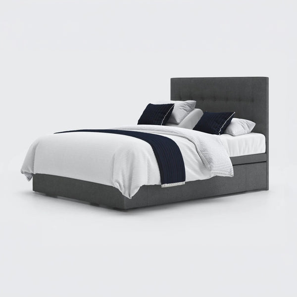 Opera Beds Emerald Motion Adjustable Divan Bed with white bedding, black accent pillows and black throw, front view.