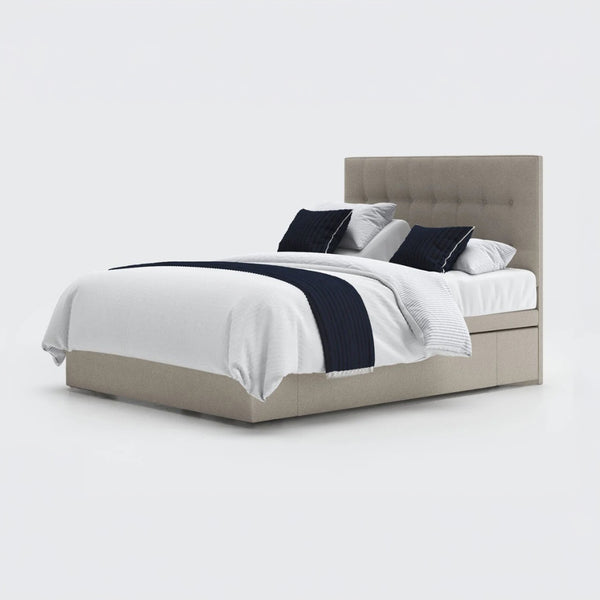 Opera Beds Emerald Motion Adjustable Divan Bed with tall tufted headboard, wireless handset and white bedding, front view.