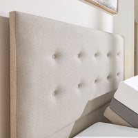 Emerald Motion Adjustable Divan Bed with upholstered headboard, shown in a bright bedroom, front view.