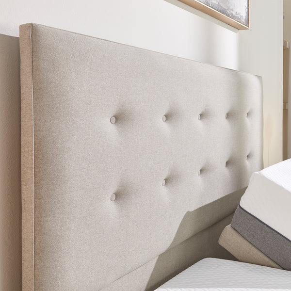 Emerald Motion Adjustable Divan Bed with upholstered headboard, shown in a bright bedroom, front view.