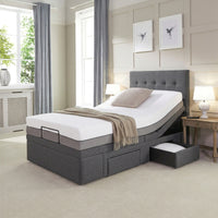 Opera Beds Emerald Motion Adjustable Divan Bed with head elevated and storage drawers, shown in a bright bedroom, side view.