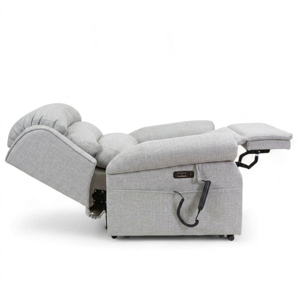 Repose Seating ErgoRise Dual Motor Tilt-In-Space Chair, fully reclined with footrest, side lever and lumbar support, side view.