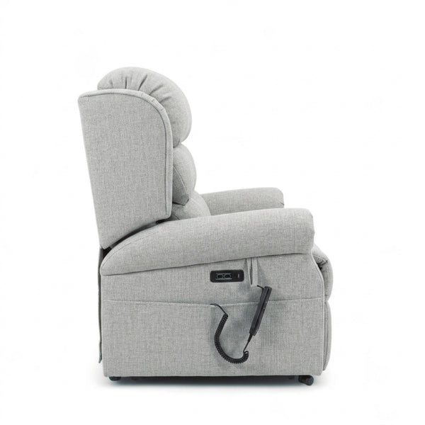Repose Seating ErgoRise Dual Motor Tilt-In-Space Chair with adjustable lumbar support and right-arm remote, side view.