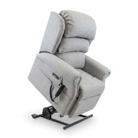 Repose Seating ErgoRise Dual Motor Tilt-In-Space Chair partially raised on black base, white background, side view.