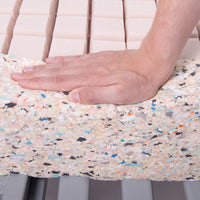 Hand pressing down on Thorpe Mill Firm Edge Mattress showing pressure-relieving foam and flexibility, close-up view.