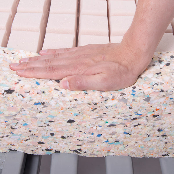 Hand pressing down on Thorpe Mill Firm Edge Mattress showing pressure-relieving foam and flexibility, close-up view.