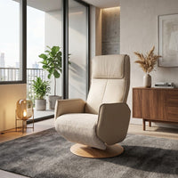 Modern Motion Fitzroy riser recliner chair on grey rug, with plants and wood decor in a living room, front angle.