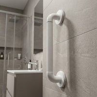 Fluted grab rail with extra grip, fitted beside a sink on tiled wall, shower area in background, side view.