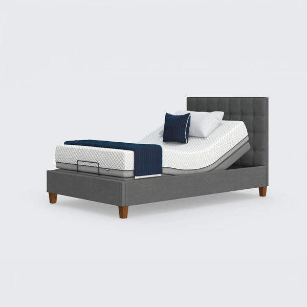 Opera Beds Flyte Adjustable Bed with Zero Gravity, white mattress, blue blanket and pillows on a white background, front view.