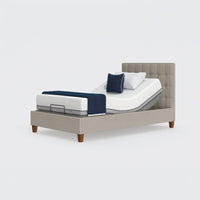 Opera Beds Flyte Adjustable Bed with Zero Gravity, tufted headboard, white mattress, blue cover and multiple pillows front view.