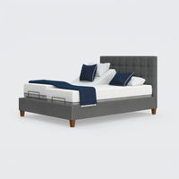 Opera Beds Flyte adjustable bed with split mattresses, Zero Gravity feature, wooden legs, and blue and white bedding, front view.