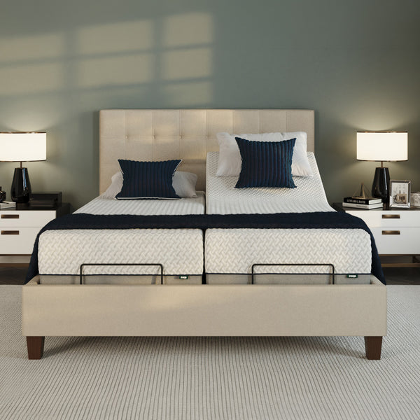 Opera Beds Flyte Adjustable Bed with white bedding, navy pillows, nightstands; zero gravity and anti-snore settings, front view.