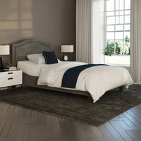 Flyte Adjustable Bed by Opera Beds with white bedding, blue accents, and sheer-curtained window in a modern bedroom, front view.