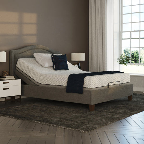 Opera Beds Flyte Adjustable Bed with white bedding, dark pillows, nightstands, lamps and sheer curtains, front view.