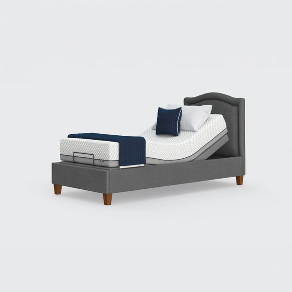 Opera Beds Flyte Adjustable Bed with Zero Gravity, white mattress and navy bedding on plain white background, front view.