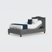 Opera Beds Flyte Adjustable Bed with blue and white bedding and two pillows on a white background, front view.