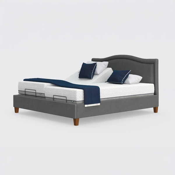 Flyte Adjustable Bed with white mattresses, blue blankets, and pillows set in Zero Gravity and anti-snore positions, front view.