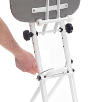 Hand adjusting the metal lever on a Drive Folding Perching Stool, close-up view.
