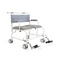 Prism Medical Freeway T100 bariatric shower chair with adjustable footrests, armrests and four wheels, side view.