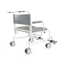 Prism Medical Freeway T100 bariatric shower chair with wheels, padded seat, backrest and adjustable footrests, side view.