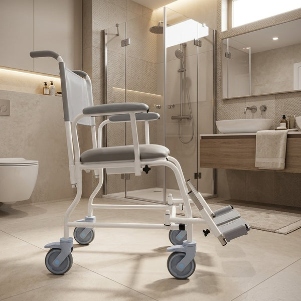 Prism Medical Freeway T40 Mobile Shower Chair in accessible bathroom with glass shower and sink, front view.