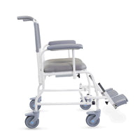 Prism Medical Freeway T40 Mobile Shower Chair with cushions, 4 wheels, footrests and antimicrobial protection, side view.