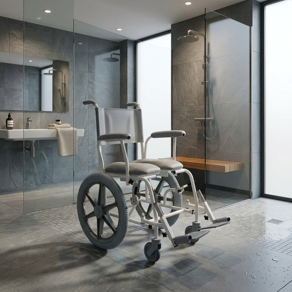 Prism Medical Freeway T60 Self-Propel Shower Chair in accessible bathroom with shower and sink, centre view.