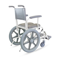 Prism Medical Freeway T60 Self-Propel Shower Chair with padded seat and armrests, rear view on white.