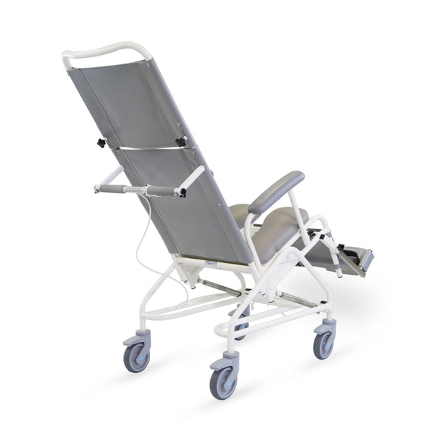 Prism Medical Freeway T80 Reclining Shower Chair with armrests and large swivel wheels, rear-side view.