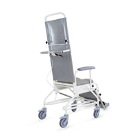 Prism Medical Freeway T80 Reclining Shower Chair with four wheels, armrests and adjustable backrest, side view.