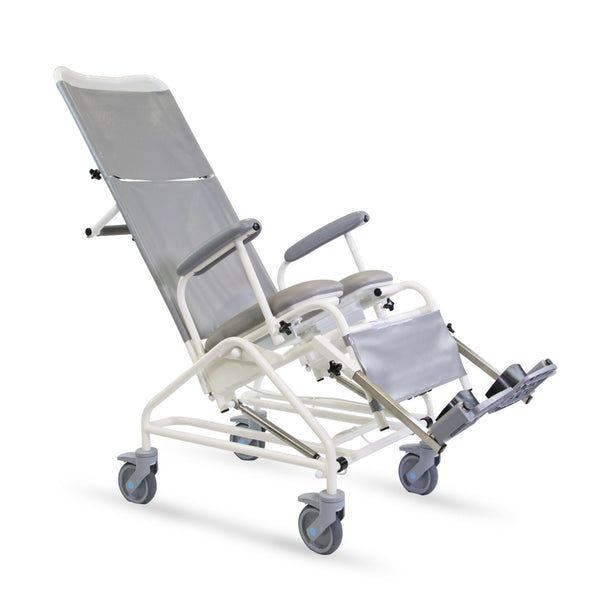 Freeway T80 reclining shower chair with armrests, footrests and four wheels, flame-retardant design, side view.