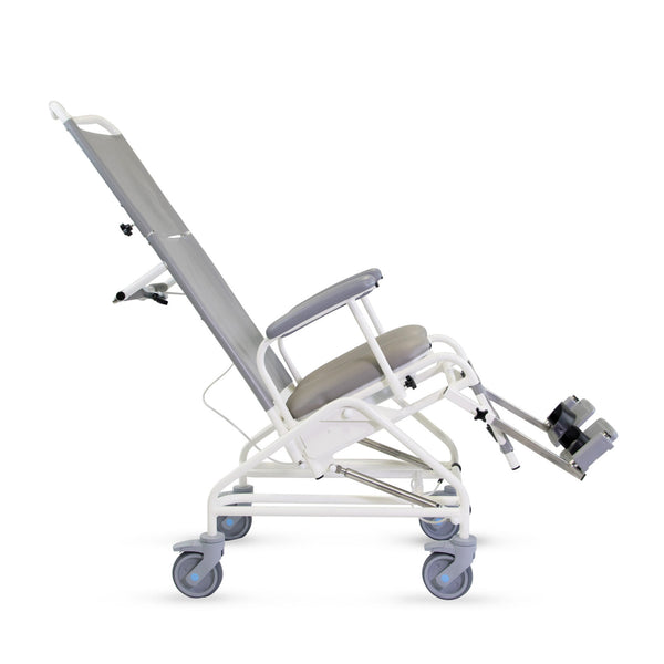 Prism Medical Freeway T80 Reclining Shower Chair with armrests, leg support and four large wheels, side view.