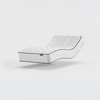 Opera Beds Gel 1000 Adjustable Mattress with wave-like curve on a plain background, angled side view.