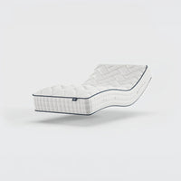 Opera Beds Gel 1000 Adjustable Mattress reclined with memory foam and quilted surface, white background, angled side view.