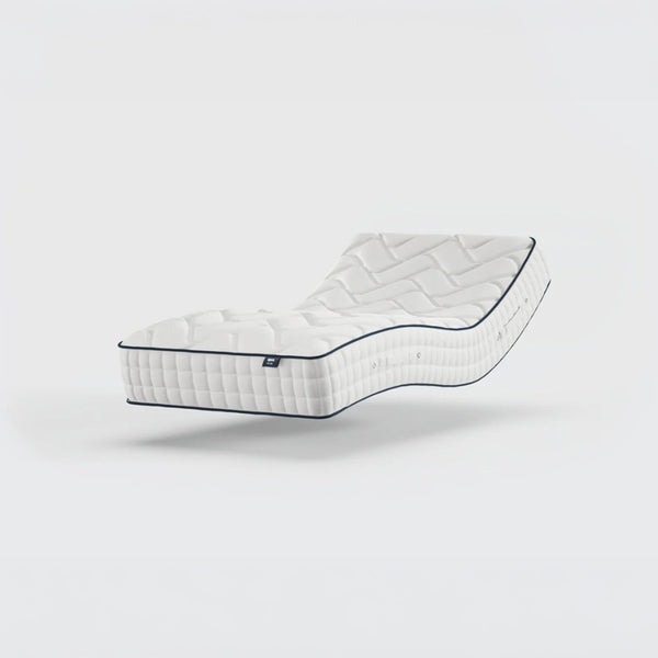 Opera Beds Gel 1000 Adjustable Mattress reclined with memory foam and quilted surface, white background, angled side view.