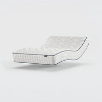 Opera Beds Gel 1000 Adjustable Mattress with quilted pattern bending at the middle, plain background, side view.