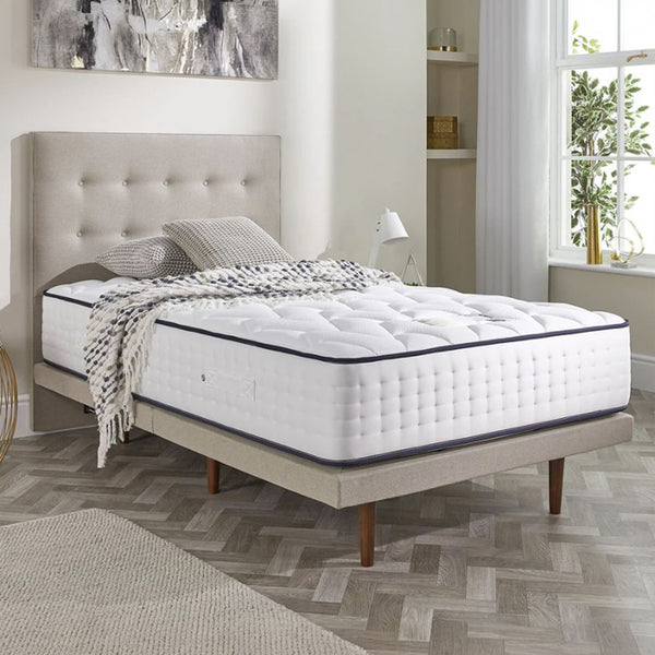gel 1000 adjustable mattress on a bed side view in a bedroom setting with added cushions