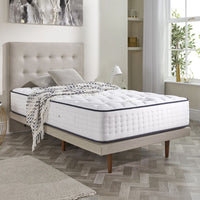 Opera Beds Gel Pro 4000 Adjustable Mattress with tufted headboard in a modern bedroom, large window letting in sunlight, front view.
