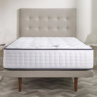 Opera Beds Gel Pro 4000 Adjustable Mattress with tufted headboard on wooden legs, bedroom setting, front view.