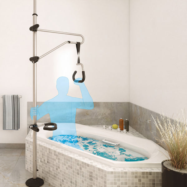 GRIPO Bed Hoist used by a person as support to enter a bathtub, modern bathroom with towels and plant, in use view.