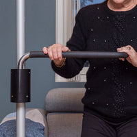 GRIPO Multi Grip Support Handle in use for balance, living room setting, side view.