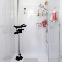 Shower with GRIPO Circular Grip 360° support, anti-slip base, handheld showerhead, and toiletries shelves, front view.