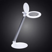 Daylight Company Halo Go 2 Magnifying Lamp with round lens and adjustable arm, front view.